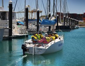 boat full of passengers in the marina