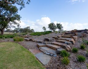 Rock steps with some bushes nearby