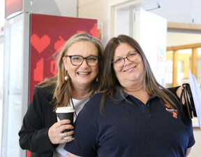 Two women smiling at the camera
